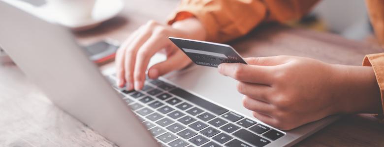 Laptop hands and card